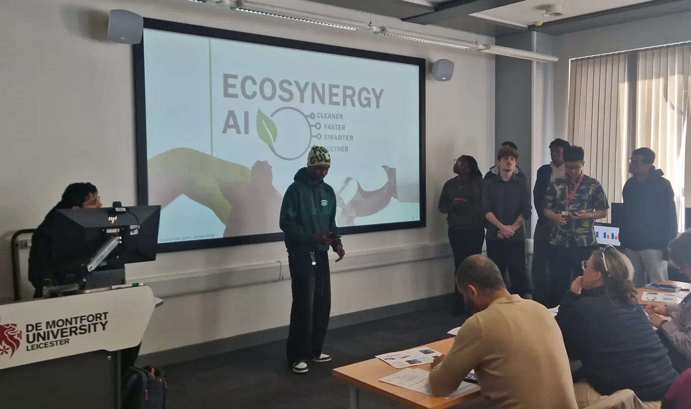 Fhaeeq presenting the EcoSynergy pitch to the judging panel, with his team standing behind him